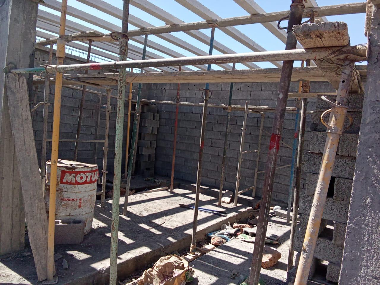 Interior of building under construction with concrete block walls