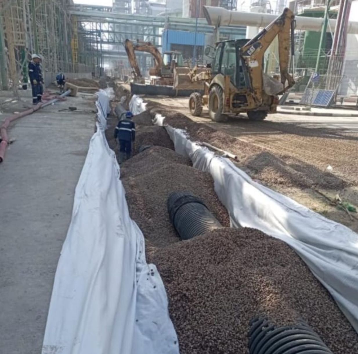 Drainage trench with geotextile fabric and pipe installation